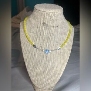 #19. Handmade Yellow Beaded Necklace with Floral Charm